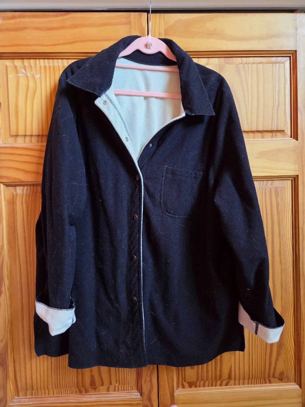The Plus Size Reversible Black/White Shirt Jacket is a versatile and stylish add